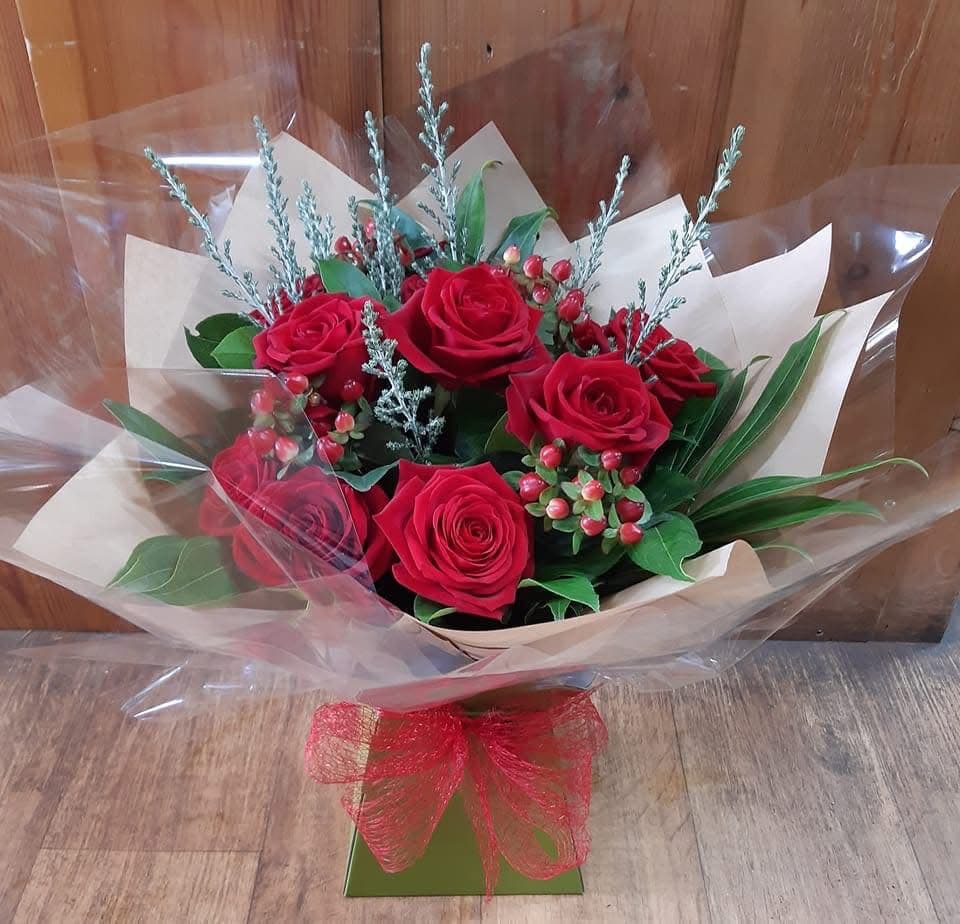 Beautiful floral bouquet held by hand